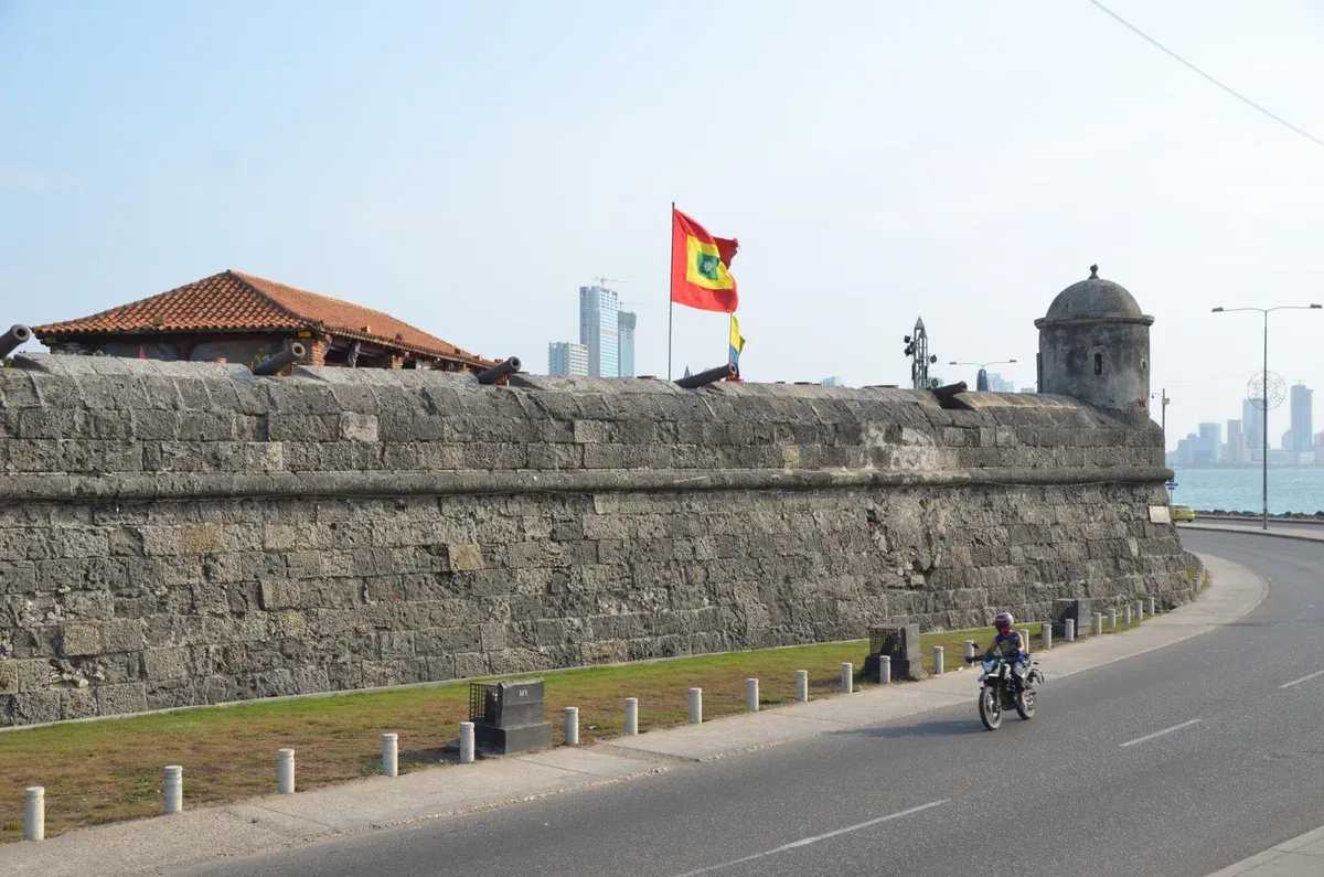 The sea-facing rampart with a sentry box and cannon on a Cartagena, Colombia city guide