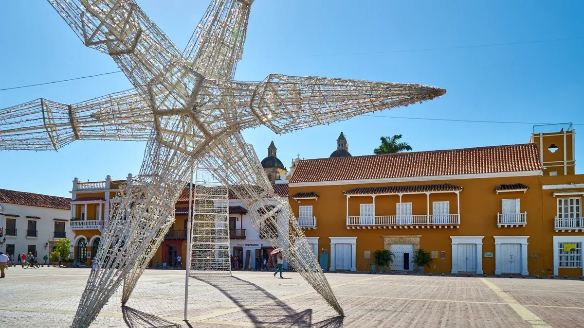 The broad colonial customs square with the city hall behind it on a Cartagena, Colombia city guide